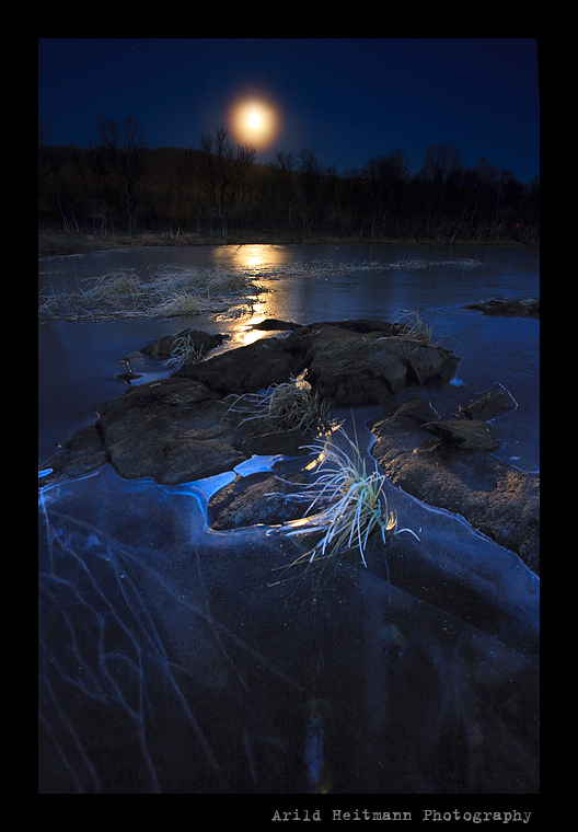 Moonlight over frozen lake II by uberfischer
